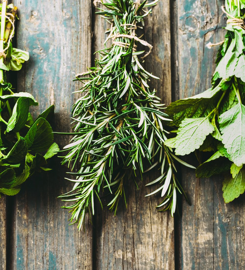 Fresh herbs. Melissa, rosemary and mint in rustic setting